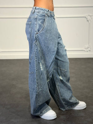 jeans con bottone sovrapposto