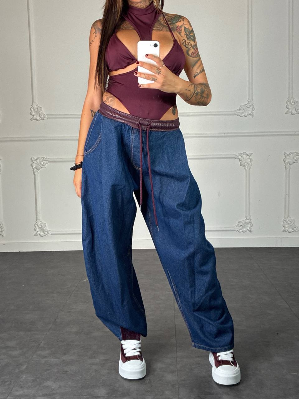 Jeans baggy con bordo in pelle