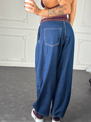 Jeans baggy con bordo in pelle