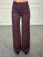 Pantalone palazzo in pizzo con vita alta e trasparenze sulle gambe
