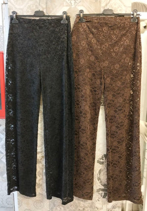 Pantalone palazzo in pizzo con vita alta e trasparenze sulle gambe