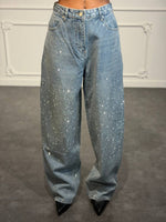 Jeans palazzo con strass degradé e gamba ampia